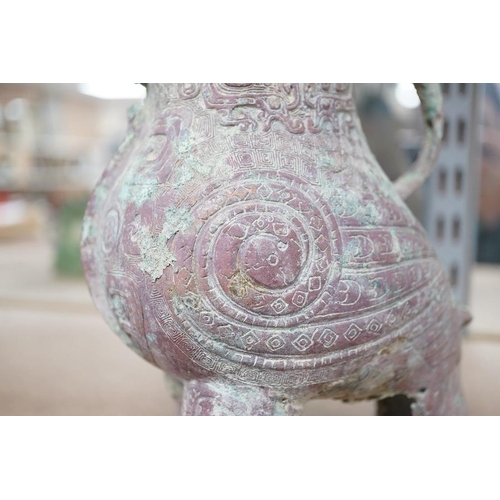 1385 - A Chinese archaistic bronze wine vessel, 22cm high. Condition - fair