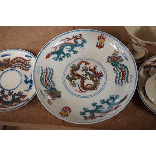 1393 - A pair of Chinese pedestal cups and three saucers. Condition - one cup severely damaged