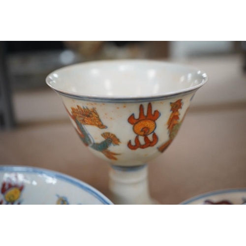 1393 - A pair of Chinese pedestal cups and three saucers. Condition - one cup severely damaged