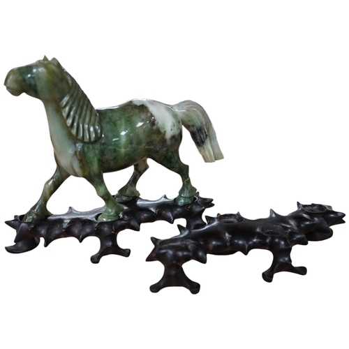 1394 - A pair of mid 20th century Chinese jadeite figures of horses, raised on hardwood stands, 13cm wide. ... 