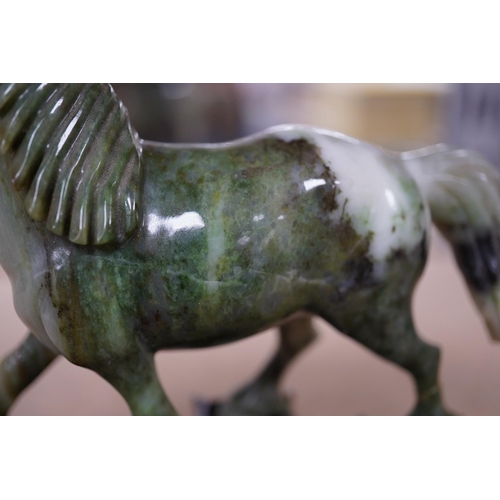 1394 - A pair of mid 20th century Chinese jadeite figures of horses, raised on hardwood stands, 13cm wide. ... 