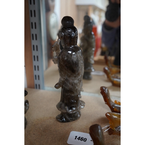 1396 - A 19th century Chinese smoky quartz figure of a standing lady holding a fruiting branch, 23cm high. ... 