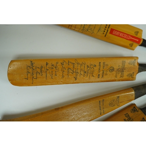 1401 - Four miniature model cricket bats, one signed, others printed. Condition - fair to good