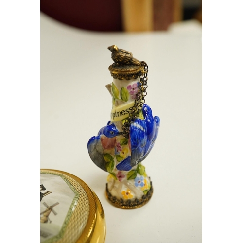 1402 - A miniature porcelain egg shaped scent bottle, on chain, two Halcyon Days scent bottles and a circul... 