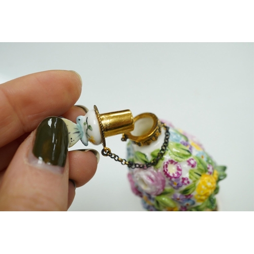 1402 - A miniature porcelain egg shaped scent bottle, on chain, two Halcyon Days scent bottles and a circul... 