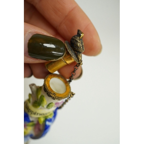 1402 - A miniature porcelain egg shaped scent bottle, on chain, two Halcyon Days scent bottles and a circul... 