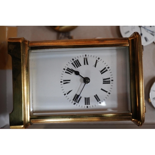 1407 - A brass cased carriage clock and assorted pocket watch movements, etc. Condition - varies