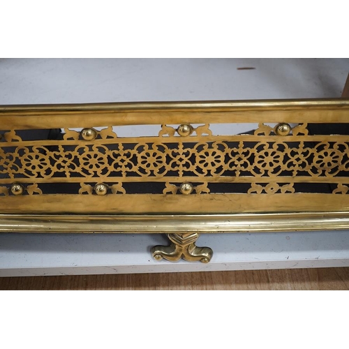 1419 - An early 19th century brass fender with pierced decoration, 91cm wide. Condition - fair to good... 