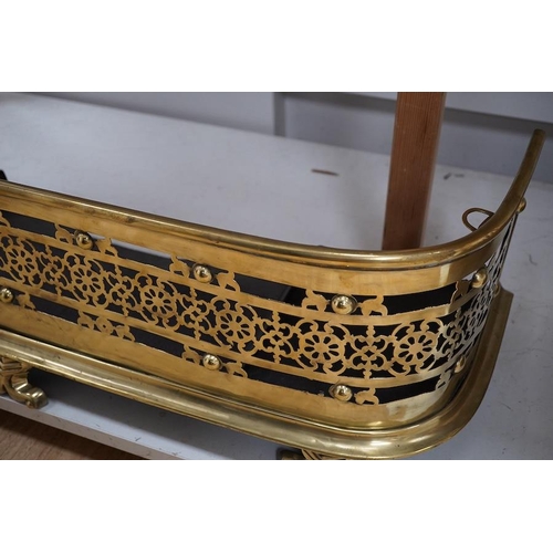 1419 - An early 19th century brass fender with pierced decoration, 91cm wide. Condition - fair to good... 