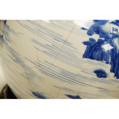 1429 - A Chinese blue and white bottle vase decorated with a landscape, 47cm high. Condition - poor