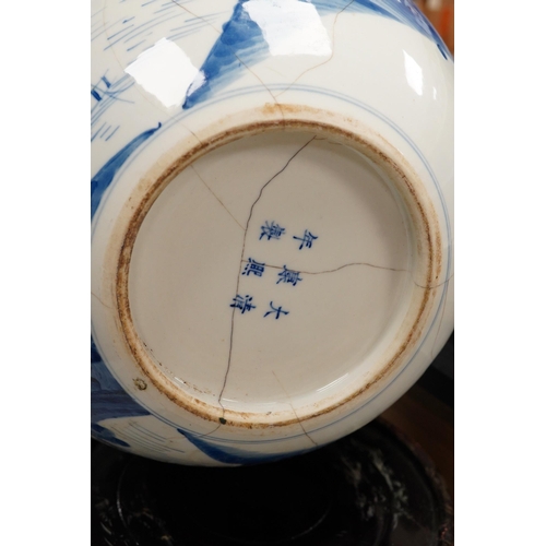 1429 - A Chinese blue and white bottle vase decorated with a landscape, 47cm high. Condition - poor