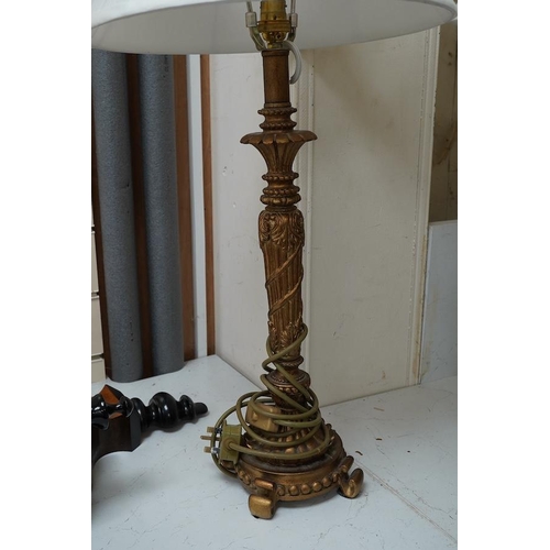 1432 - A pair of gilt resin table lamps with white shades, 76cm high. Condition - fair to good.