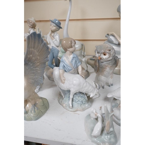 1434 - A quantity of Lladro style and Nao figures (12). Condition - good