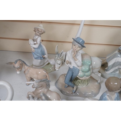 1434 - A quantity of Lladro style and Nao figures (12). Condition - good