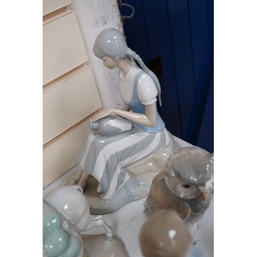 1434 - A quantity of Lladro style and Nao figures (12). Condition - good