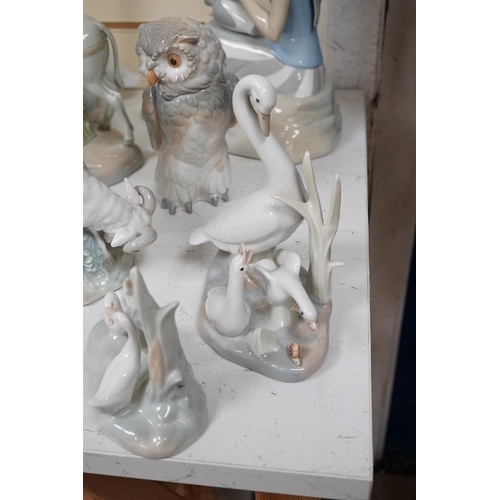 1434 - A quantity of Lladro style and Nao figures (12). Condition - good