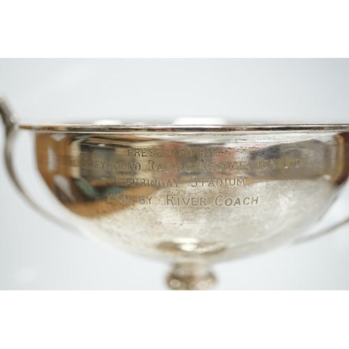 1829 - A 1930's silver two handled presentation greyhound trophy cup, with greyhound head handle terminals ... 