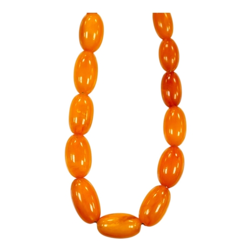 1900 - A single strand graduated amber bead necklace, 66cm, gross weight 40 grams. Condition - poor to fair... 