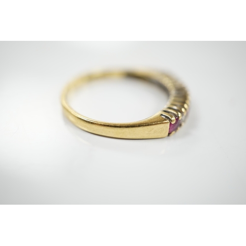 1903 - A modern 18ct gold, four stone ruby and three stone diamond set half hoop ring, size P, gross weight... 