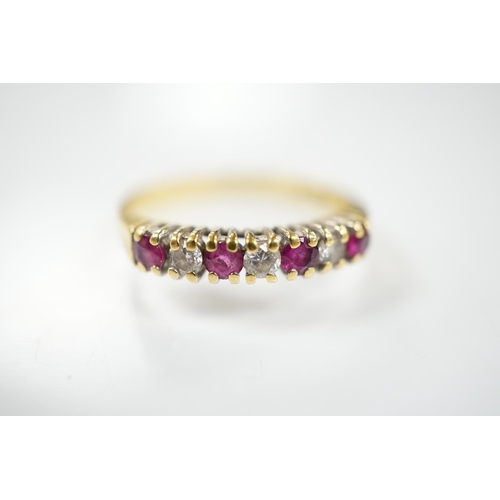 1903 - A modern 18ct gold, four stone ruby and three stone diamond set half hoop ring, size P, gross weight... 