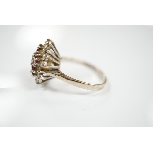 1905 - An 18ct white metal, ruby and diamond cluster ring, size P, gross weight 7 grams. Condition - fair... 