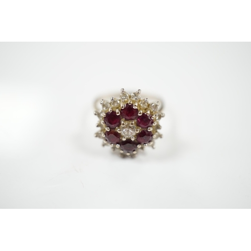 1905 - An 18ct white metal, ruby and diamond cluster ring, size P, gross weight 7 grams. Condition - fair... 