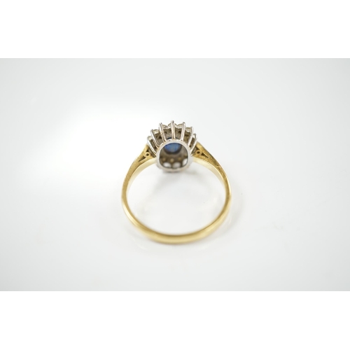 1910 - A modern 18ct gold, sapphire and diamond set oval cluster ring, size P/Q, gross weight 4.9 grams. Co... 