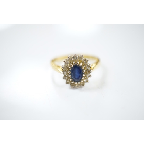 1910 - A modern 18ct gold, sapphire and diamond set oval cluster ring, size P/Q, gross weight 4.9 grams. Co... 