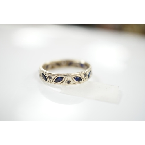 1911 - A 9ct white metal, shaped sapphire and diamond chip set eternity ring, size N, gross weight 3.7 gram... 