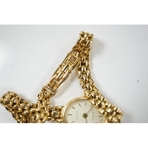 1913 - A lady's modern 9ct gold Tissot quartz wrist watch, on a 9ct gold bracelet, gross weight 19.5 grams.... 