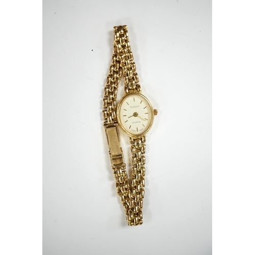 1913 - A lady's modern 9ct gold Tissot quartz wrist watch, on a 9ct gold bracelet, gross weight 19.5 grams.... 