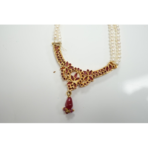 1915 - A recent Indian gilt metal and freshwater pearl and ruby cluster set twin strand necklace, 46cm and ... 