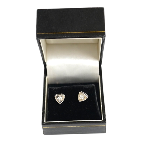 1921 - A modern pair of 18ct white gold and single stone diamond set ear studs, 6mm, gross weight 2.8 grams... 