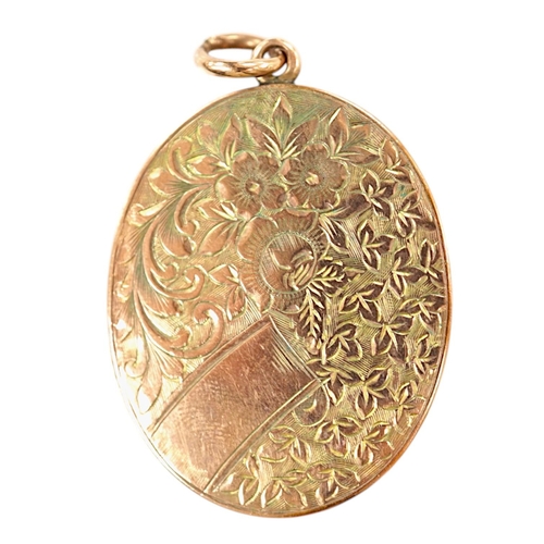 1923 - A George V engraved 9ct gold oval locket, 35mm, gross weight 11.7 grams. Condition - fair to good... 