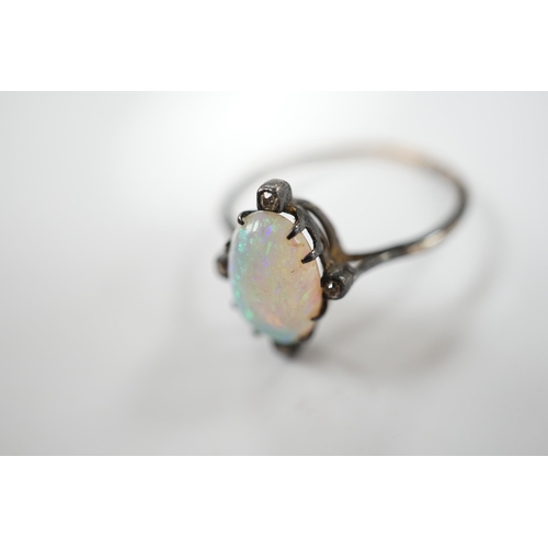 1924 - An antique, yellow and white metal, white opal and diamond set ring, size T, gross weight 2.1 grams.... 