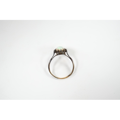 1924 - An antique, yellow and white metal, white opal and diamond set ring, size T, gross weight 2.1 grams.... 