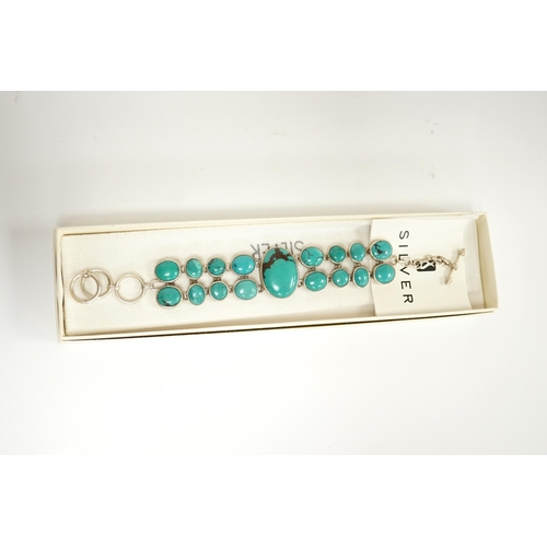 1926 - A modern silver and two row turquoise cluster set bracelet, overall 22cm. Condition - good