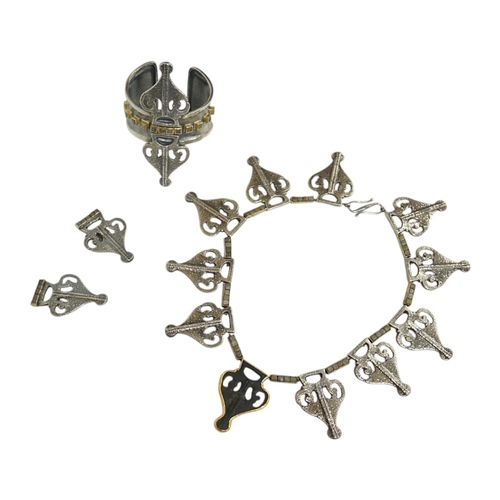 1929 - An unusual recent suite of German 925, yellow metal, iron and rough cut diamond set jewellery, compr... 