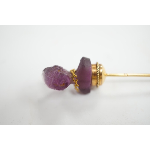 1931 - An early 20th century French yellow metal (18ct poincon mark) and amethyst paste set stick pin, the ... 