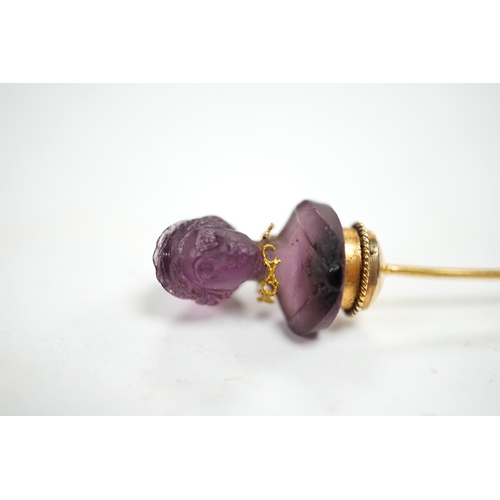 1931 - An early 20th century French yellow metal (18ct poincon mark) and amethyst paste set stick pin, the ... 