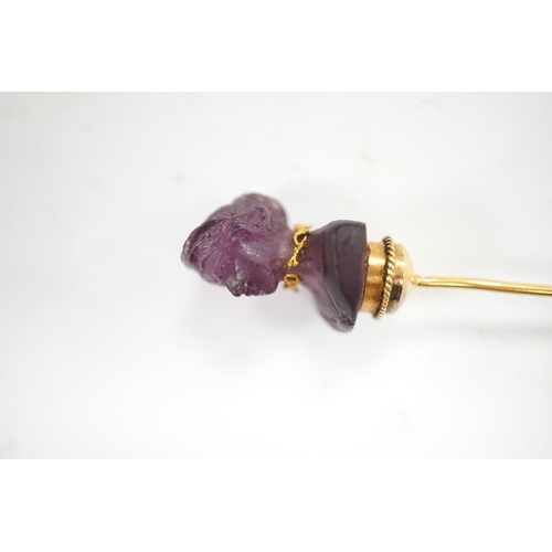 1931 - An early 20th century French yellow metal (18ct poincon mark) and amethyst paste set stick pin, the ... 