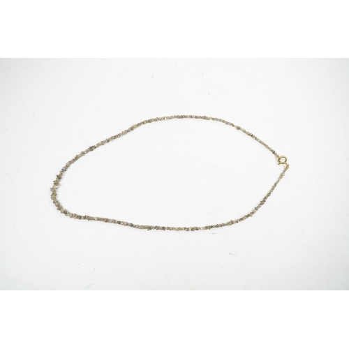 1934 - A single strand rough cut diamond necklace, with 750 yellow metal clasp, 40cm. Condition - fair... 