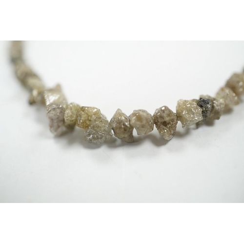 1934 - A single strand rough cut diamond necklace, with 750 yellow metal clasp, 40cm. Condition - fair... 