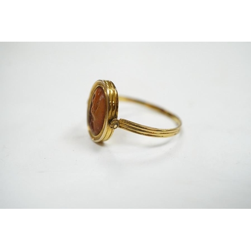 1935 - A 19th century French? yellow metal and oval intaglio paste set swivelling ring, size N, gross weigh... 