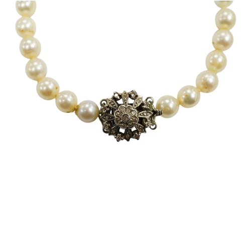 1936 - A single strand cultured pearl necklace, with diamond chip set white metal clasp, 88cm. Condition - ... 