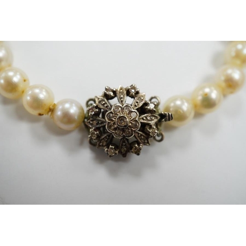 1936 - A single strand cultured pearl necklace, with diamond chip set white metal clasp, 88cm. Condition - ... 