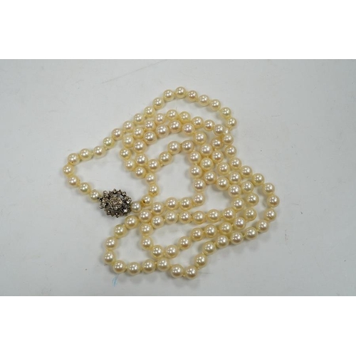 1936 - A single strand cultured pearl necklace, with diamond chip set white metal clasp, 88cm. Condition - ... 