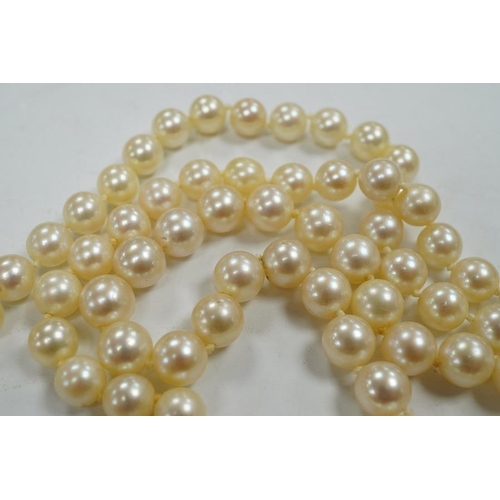 1936 - A single strand cultured pearl necklace, with diamond chip set white metal clasp, 88cm. Condition - ... 