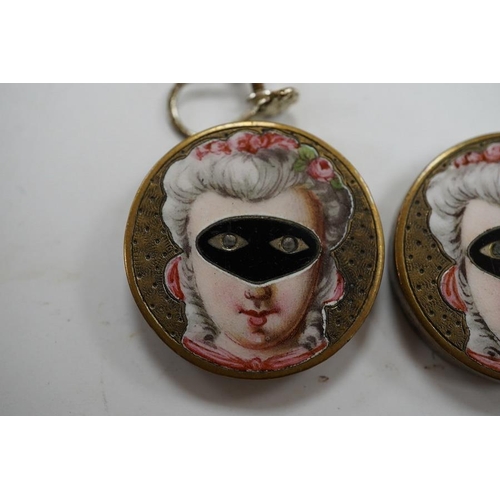 1937 - A pair of engraved gilt metal enamel and paste set disc shaped buttons )converted to earrings, one f... 