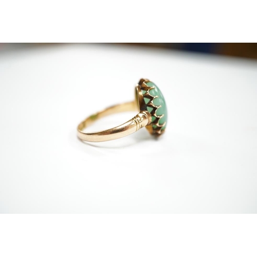 1939 - A mid 20th century yellow metal and single stone cabochon jade set ring, size Q, gross weight 5.6 gr... 